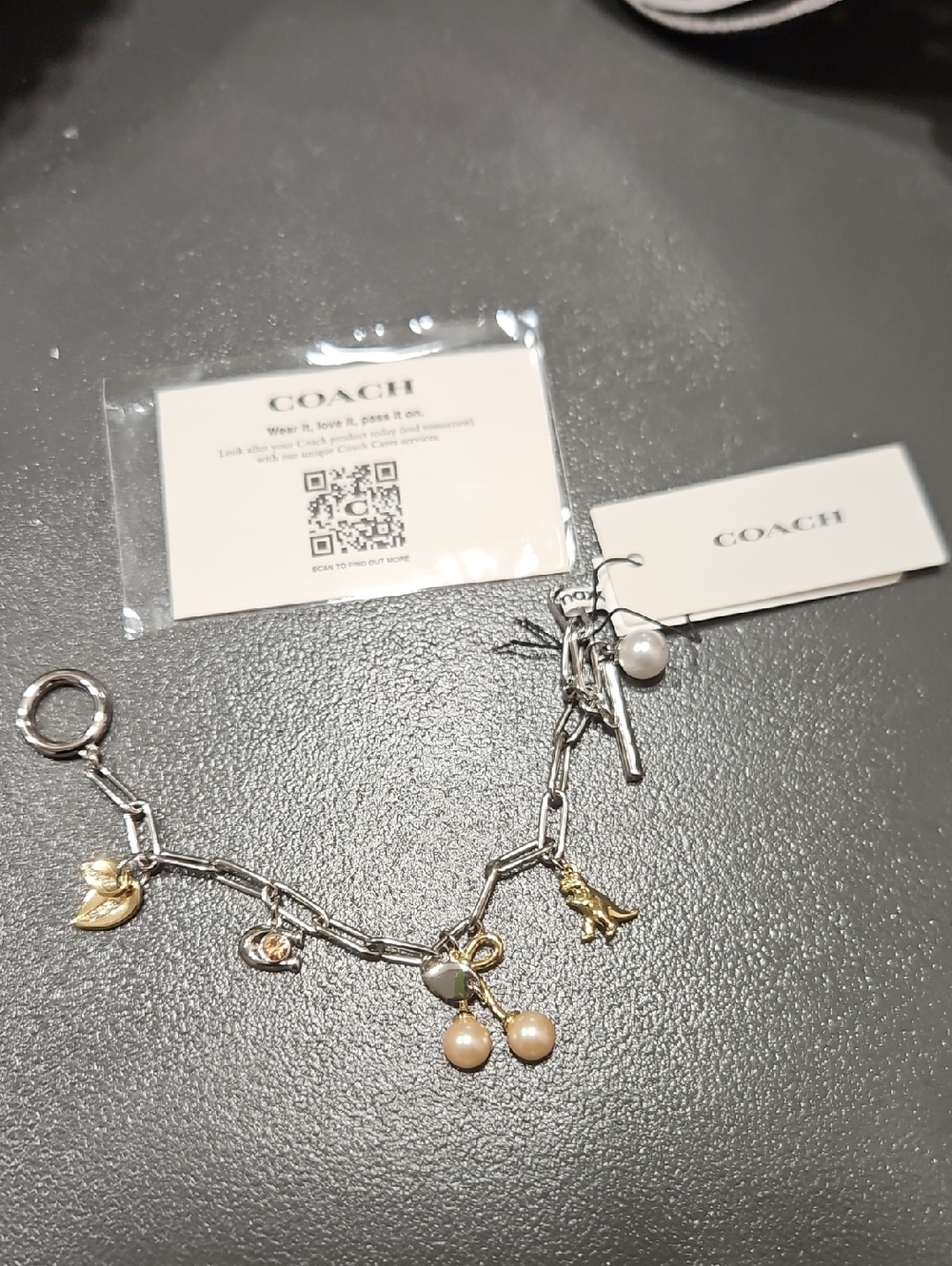 Coach Two-Tone Charm Bracelet with Pearl and Gold Accents